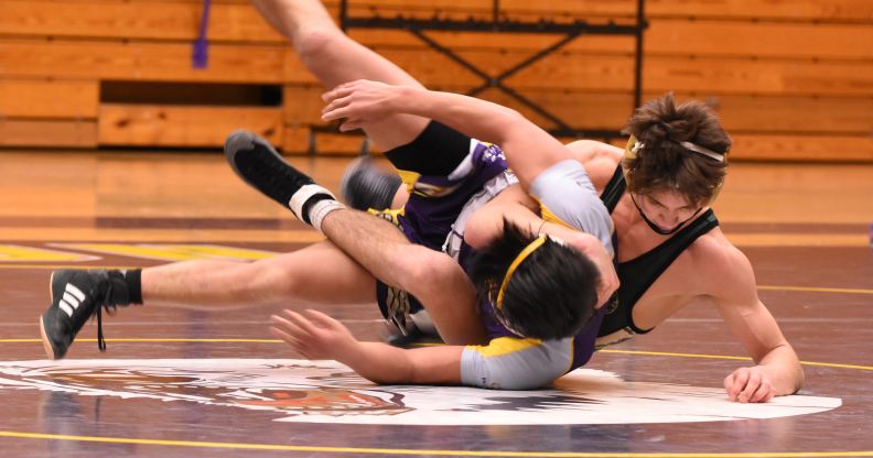 A priest was caught taking photos in a high school gym during a wrestling tournament without consent or knowledge. (Stock photo via UnSplash)
