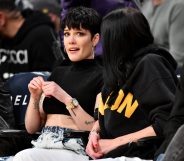 Halsey at a basketball game, looking worried