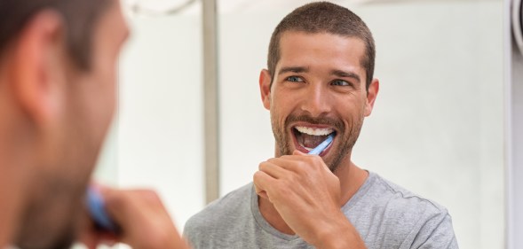 He wouldn't be smiling if he used that toothpaste as lube, though. (Stock photo via Elements Envato)