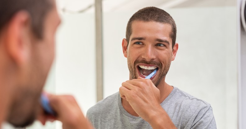 He wouldn't be smiling if he used that toothpaste as lube, though. (Stock photo via Elements Envato)