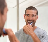 He wouldn't be smiling if he used that toothpaste as lube, though. (Stock photo via Elements Envato)