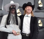 Orville Peck and Diplo laughing at the Grammys 2020
