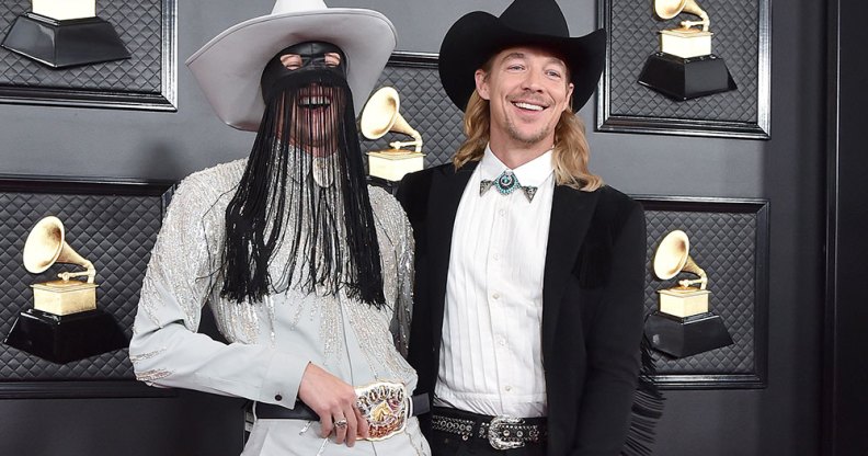 Orville Peck and Diplo laughing at the Grammys 2020