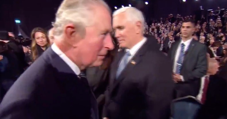 Prince Charles walking past Mike Pence