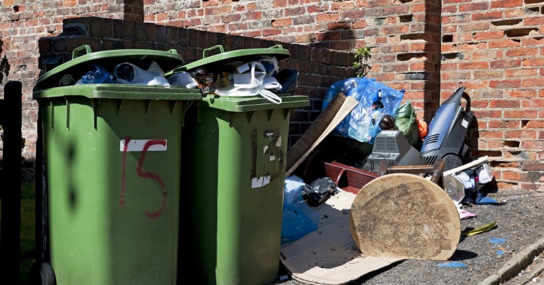 Full household waste wheelie bins and rubbish.