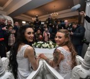 Robyn Peoples, from Belfast, and Sharni Edwards, from Brighton, pose for the media after getting married on February 11, 2020 in Carrickfergus, Northern Ireland.