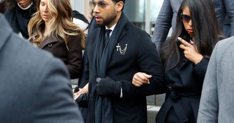 Flanked by attorneys and supporters, actor Jussie Smollett walks out of the Leighton Criminal Courthouse after pleading not guilty to a new indictment on February 24, 2020 in Chicago, Illinois.