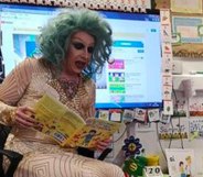 Drag queen story time performer Flowjob reading a book in a classroom