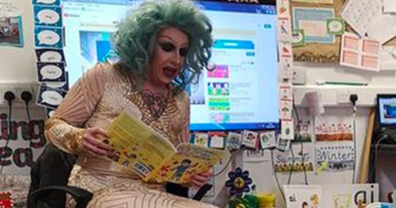 Drag queen story time performer Flowjob reading a book in a classroom