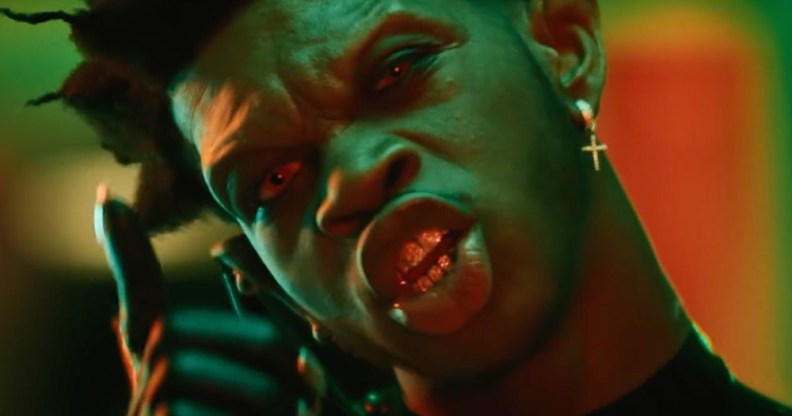 Lil Nas X with sharp vampire teeth