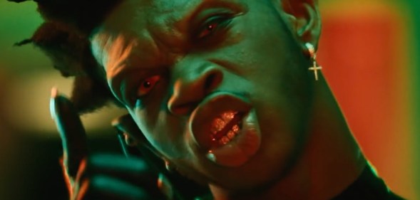 Lil Nas X with sharp vampire teeth