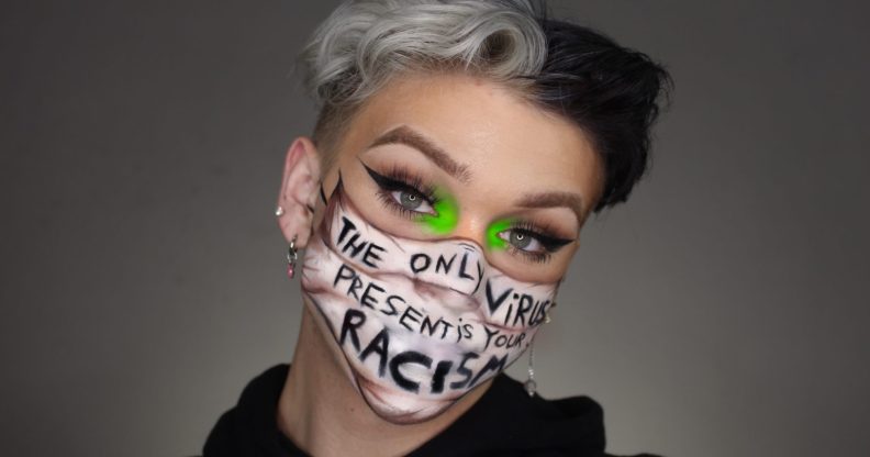 Ethan Peters in a make-up 'mask' which reads 'the only virus present is racism'