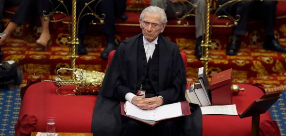 The Lord Speaker Lord Fowler listens inside the House of Lords