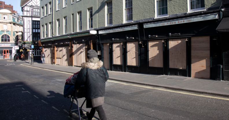 Bars and restaurants boarded up and closed down on Old Compton Street in Soho, at the heart of the West End