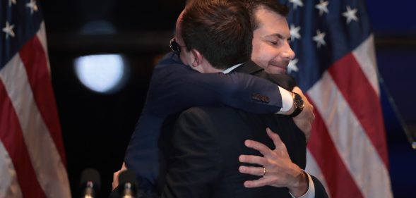 Former South Bend, Indiana Mayor Pete Buttigieg hugs his husband Chasten after announcing he was ending his campaign to be the Democratic nominee for president. (Scott Olson/Getty Images)