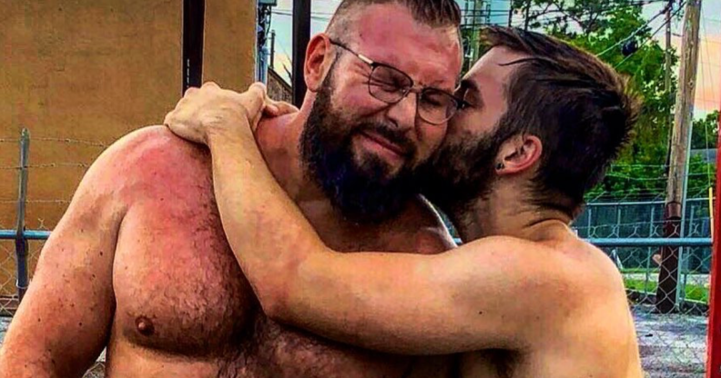 Mike Parrow (L) snuggles his husband Morgan Cole. (Instagram)