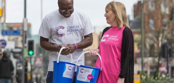 Shaking their donation buckers full of loose change with a smile, volunteers are vital for Cancer Research UK. (Cancer Research UK)