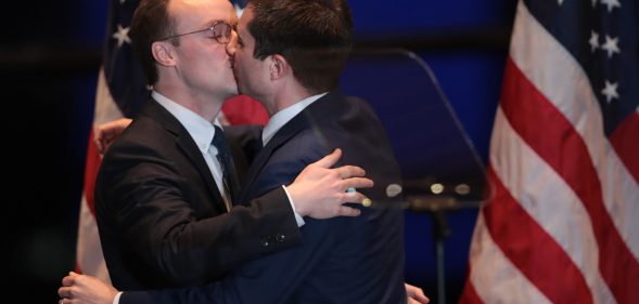 Pete Buttigieg kissing husband Chasten