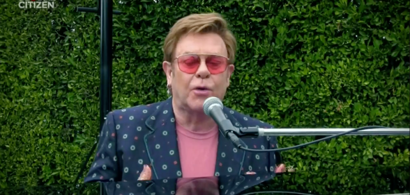 Elton John playing piano