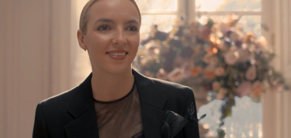 Villanelle in a black wedding suit
