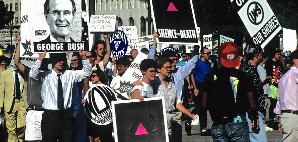 An LGBT+ Pride parade in Washington, DC, in 1991. The paranoia of the AIDS crisis that seized the country the decade-prior still lingered, and some have remarked that the sense of fear and anger is being repeated again during the coronavirus pandemic. (Mark Reinstein/Corbis via Getty Images)