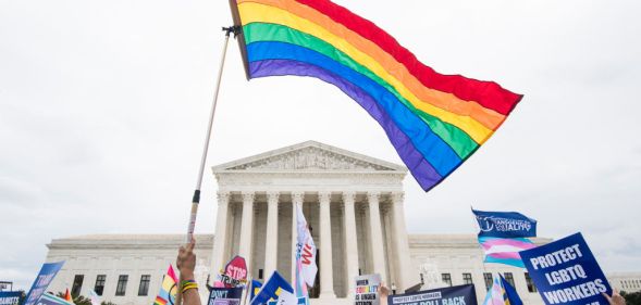 LGBT+ activists rally in front of the Supreme Court in October 2019