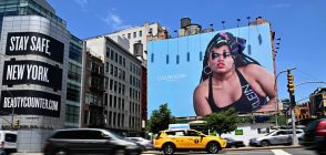 Cars drive past a billboard featuring Black trans model and activist Jari Jones in an advertisement for Calvin Klein. (Angela Weiss / AFP via Getty Images)