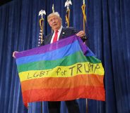 Donald Trump holds an LGBT+ Pride flag