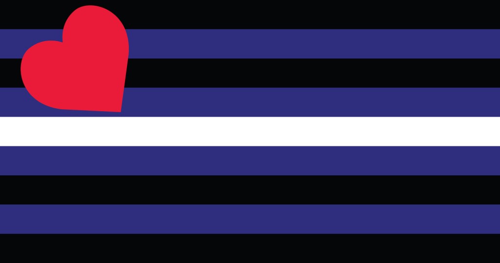 The leather Pride flag colours of black, blue and white with a red heart in the top-left corner