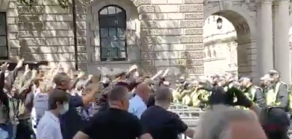 Startling video showed a gang of far-right white-supremacists flashing Nazi salutes during a riot to defend a statue of Winston Churchill, who famously defeated the Nazis. (Screen capture via Twitter)