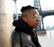 A young person looks into the distance