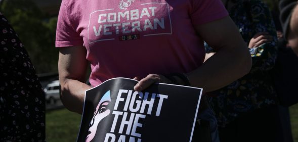 Democratic lawmakers joined activists to rally against the transgender military service ban.