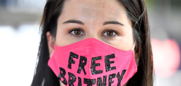 A #FreeBritney supporter wearing a pink face mask