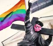 Jesus statue with rainbow flag and anarchist bandana