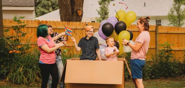 Parents throw heart-warming, belated gender reveal party for trans son