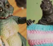 Godzilla holding a trans flag