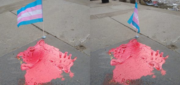 A golden imprint of JK Rowling's hands were splashed with red paint and a decorate trans Pride flag left beside it. (Supplied)