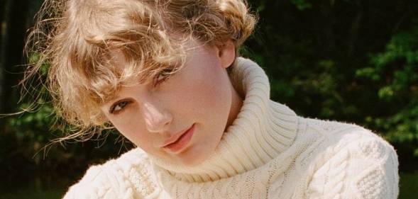 Taylor Swift wearing a cream roll neck jumper with soft curls (mid shot) queer betty