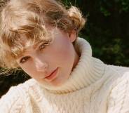Taylor Swift wearing a cream roll neck jumper with soft curls (mid shot) queer betty
