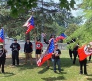 Neo-Nazi thugs march with swastikas while chanting 'f**k you f****ts'