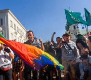 Far-right protesters attempt to burn a rainbow flag as they protest against the LGBT community on August 16, 2020 in Warsaw, Poland.
