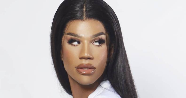 A tight crop of Naomi Smalls' face. Her hair is long, her mug is beat, her eyes looking to the right