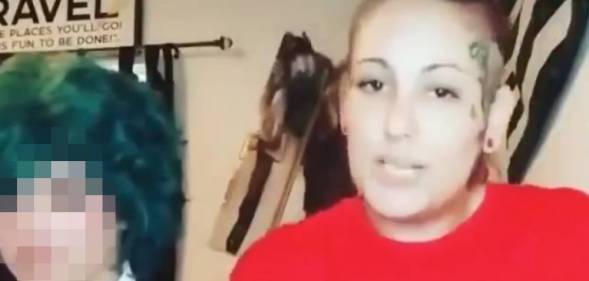 A trans boy, face blurred, with his mother