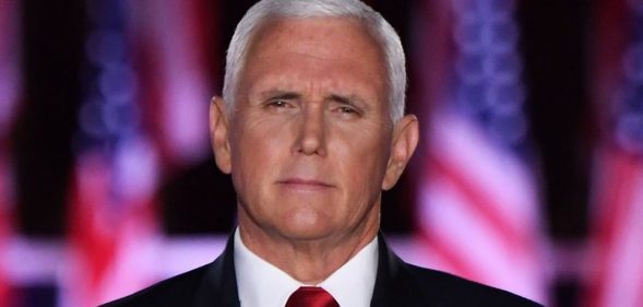 Mike Pence in front of USA flags