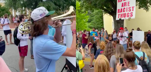trombone drowns out homophobic racist demonstrator