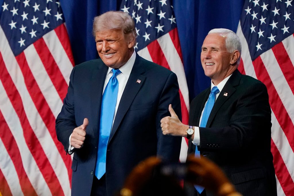 President Donald Trump and Vice President Mike Pence give a thumbs up after speaking on the first day of the Republican National Convention