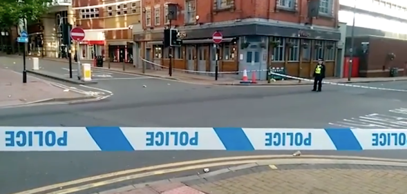 Law enforcement cordoned off the junction of Hurst Street and Bromsgrove Street after a string of stabbings that left 'a number of people' wounded. (Screen capture via Birmingham Live)