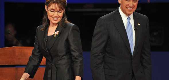 Sarah Palin and Democrat Joseph Biden walk on stage following their vice presidential debate