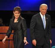 Sarah Palin and Democrat Joseph Biden walk on stage following their vice presidential debate