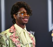 Lil Nas X in a curly wig at the Billboard Music Awards